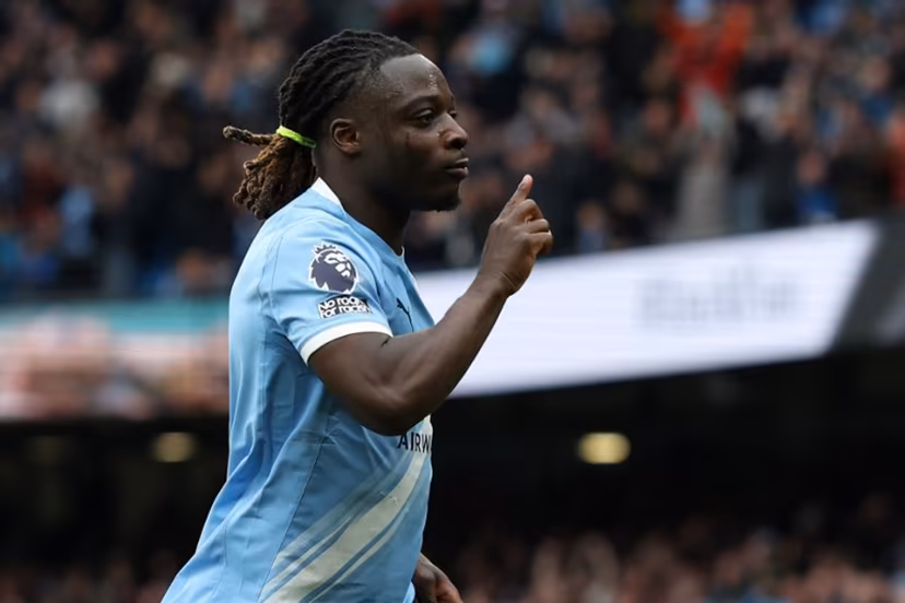 Manchester City's Belgian midfielder #11 Jeremy Doku celebrates after scoring the opening goal during the English Premier League football match between Manchester City and Brentford at the Etihad Stadium in Manchester, north west England, on May 9, 2026. Darren Staples / AFP