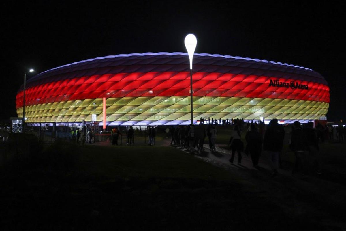 The Allianz Arena is illuminated in the German colours as fans arrive prior to the UEFA Nations League, League A Group A3 football match between Germany and the Netherlands in Munich, southern Germany on October 14, 2024. Alexandra BEIER / AFP