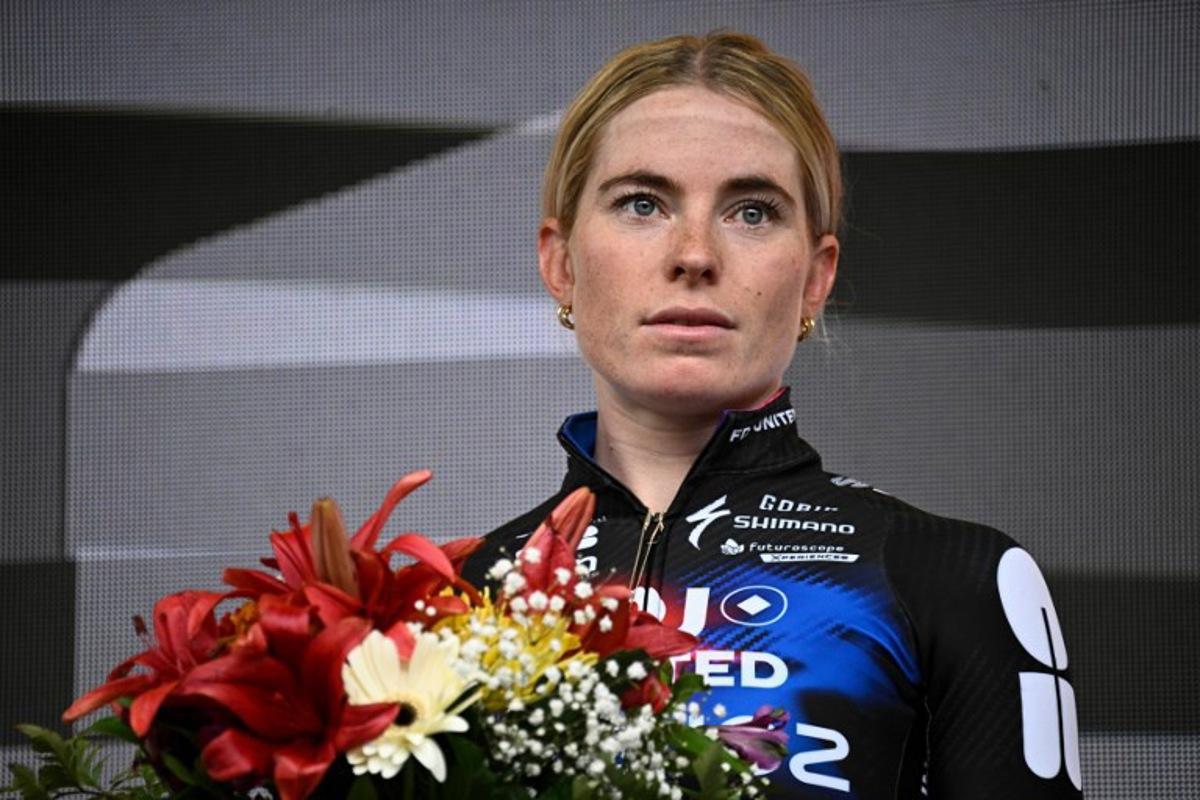 Second-placed FDJ-SUEZ team's Dutch rider Demi Vollering celebrates on the podium for the fourth edition of the Women's Tour de France cycling race at the end of the 9th and final stage (out of 9) 124.1 km from Praz-sur-Arly to Chatel, in Chatel, eastern France on August 3, 2025. JULIEN DE ROSA / AFP