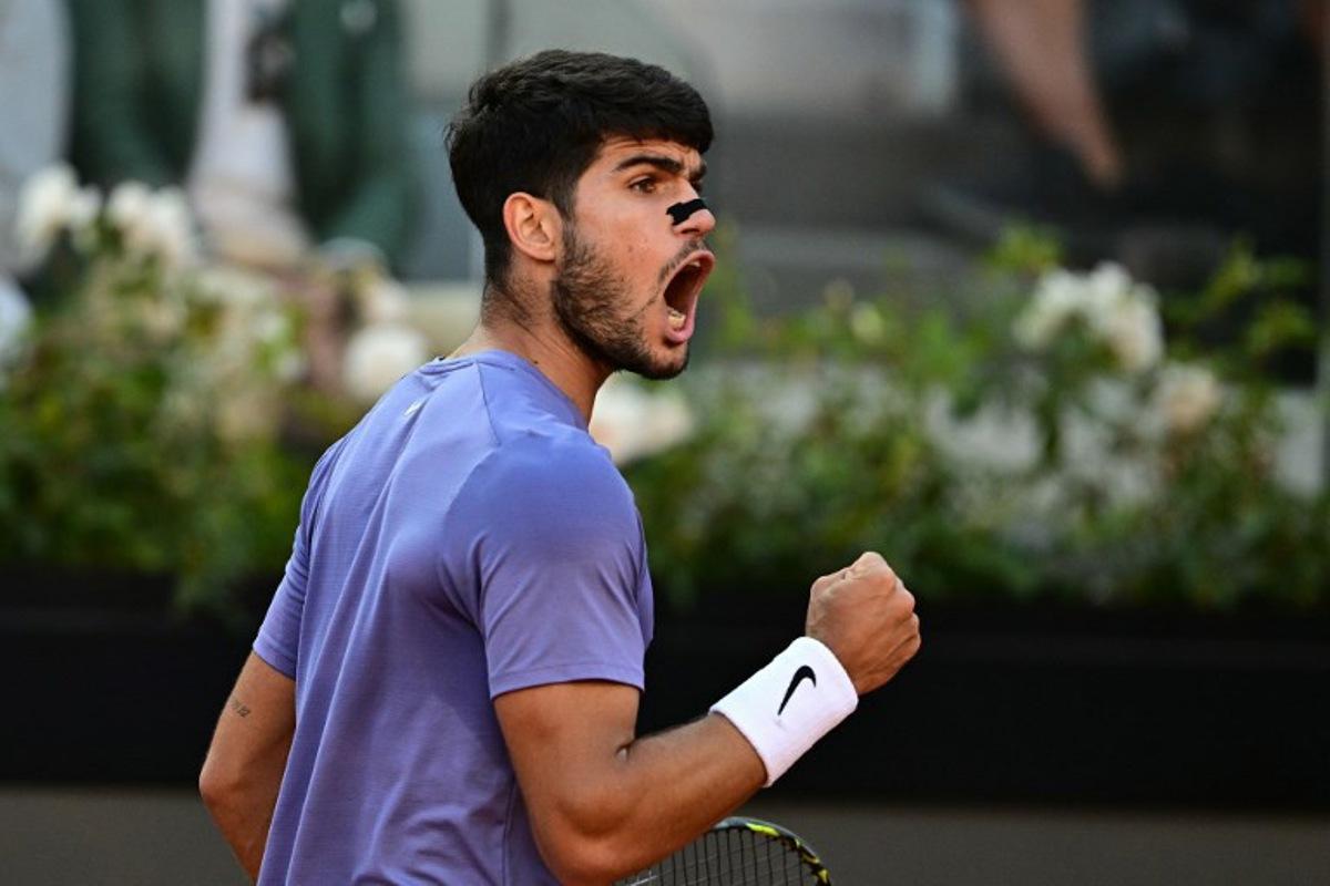 Spain's Carlos Alcaraz reacts during his men's singles final match against Italy's Jannik Sinner for the ATP Rome Open tennis tournament at Foro Italico in Rome on May 18, 2025. Tiziana FABI / AFP