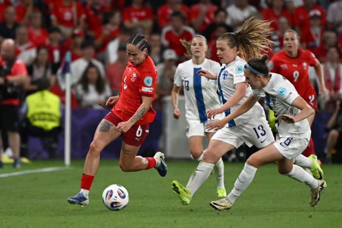 Switzerland's forward #06 Geraldine Reuteler, runs with the ball during the UEFA Women's Euro 2025 Group A football match between Finland and Switzerland at the Stade de Geneve in Geneva, on July 10, 2025. Miguel MEDINA / AFP