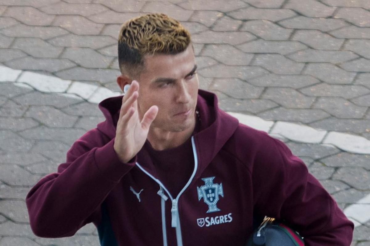 Portugal's forward #07 Cristiano Ronaldo waves to fans as he arrives for a training session at Parken stadium in Copenhagen, Denmark, on September 30, 2026, on the eve of their Nations League Group A4 match against Denmark. Portugal captain Cristiano Ronaldo announced that he had left the team's training camp in Denmark following a press conference by coach Jorge Jesus. Liselotte Sabroe / Ritzau Scanpix / AFP