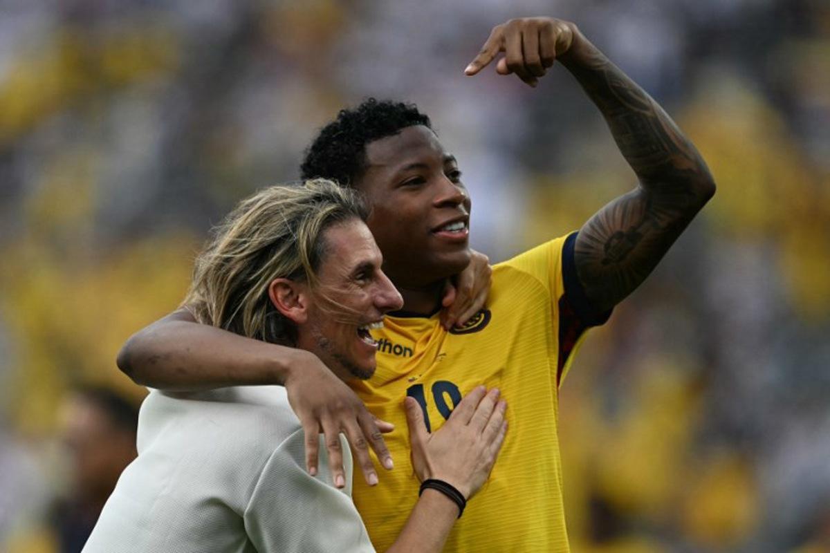 Ecuador's Argentine head coach Sebastian Beccacece and Ecuador's midfielder #19 Gonzalo Plata celebrate after winning the 2026 World Cup Group E football match between Ecuador and Germany at the New York/New Jersey Stadium in East Rutherford on June 25, 2026. MAURO PIMENTEL / AFP