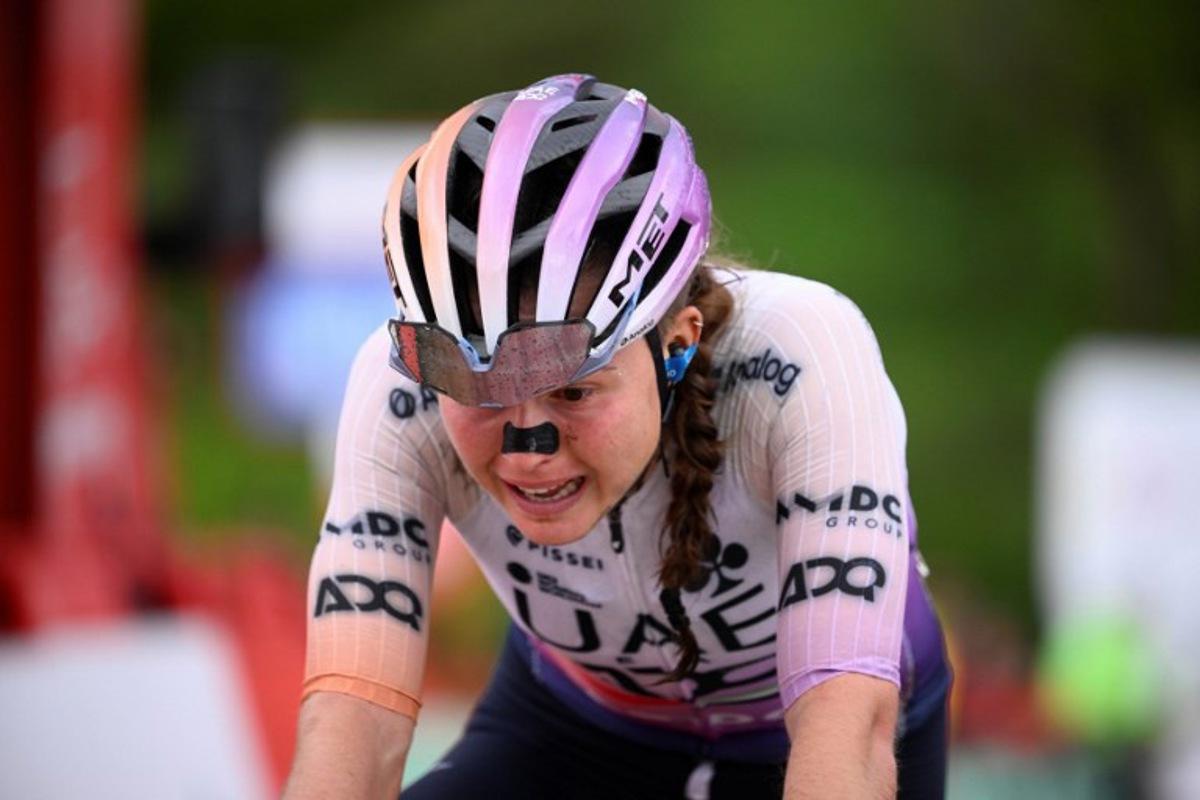 Team UAE ADQ's Spanish rider Paula Blasi Cairol crosses in second position the finish line of the 6th stage of the 2026 La Vuelta Femenina cycling tour of Spain, a 106.5 km race between Gijon and Les Praeres, on May 8, 2026. Miguel RIOPA / AFP