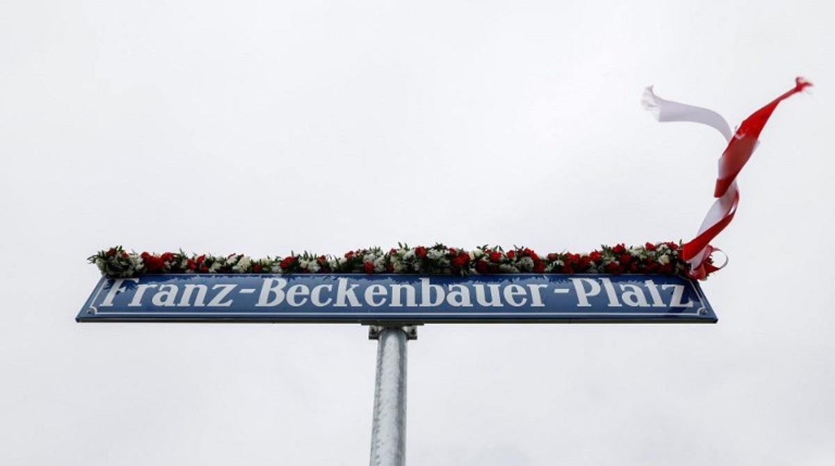 The new street sign for the 'Franz-Beckenbauer-Platz', a square named after German football legend Franz Beckenbauer, is pictured near the Allianz Arena Stadium in Munich, southern Germany, May 5, 2025. Since May 1, 2025, the stadium's official address has been changed to Franz Beckenbauer Platz 5 to honour the German football icon. The No. 5 shirt number was famously worn by Beckenbauer. He died aged 78 on January 7, 2024. Michaela STACHE / AFP