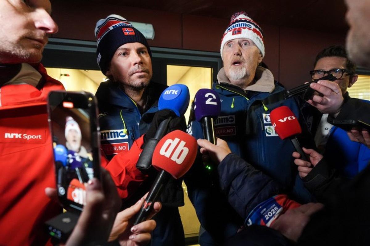 The Norwegian ski jumping national team's coach Magnus Brevig (left) and sport director Jan-Erik Aalbu deliver a press statement in Granaasen, Norway, on March 8, 2025, after two Norwegian jumpers were disqualified and accused of cheating after the men's large hill jumping competition during the World Ski Championships in Trondheim. Terje Pedersen / NTB / AFP