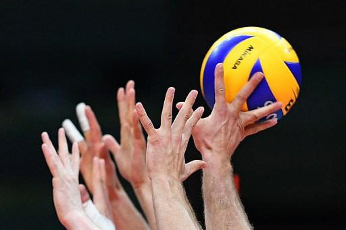 Poland players jump to block the ball during the men's qualifying volleyball match between Poland and Iran at the Maracanazinho stadium in Rio de Janeiro on August 9, 2016, during the Rio 2016 Olympic Games.
Johannes EISELE / AFP