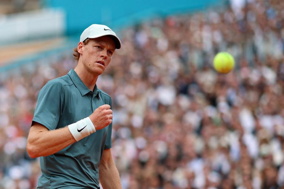Italy's Jannik Sinner reacts as he plays against Spain's Carlos Alcaraz during the Monte Carlo ATP Masters Series Tournament final tennis match on Court Rainier III at the Monte-Carlo Country Club in Roquebrune-Cap-Martin, south-eastern France on April 12, 2026. Valery HACHE / AFP