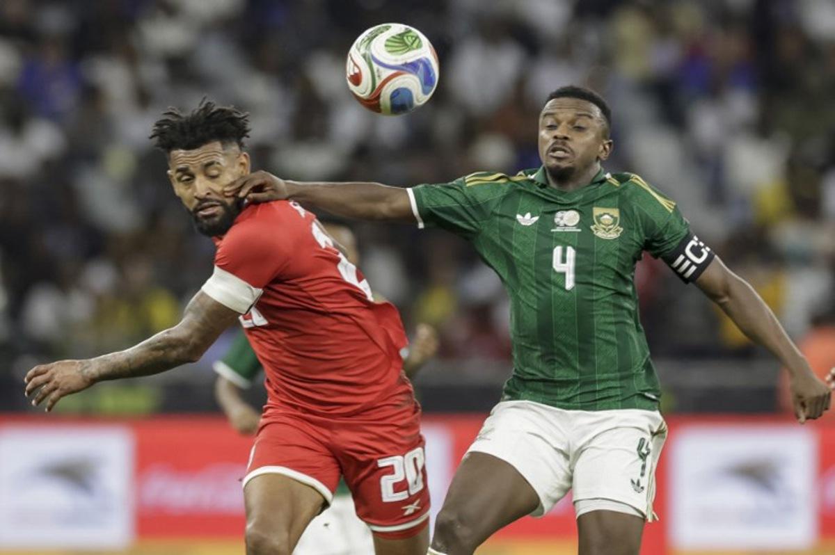 Panama's midfielder #20 Anibal Godoy fights for the ball with South Africa's midfielder #4 Teboho Mokoena during the friendly international football match between South Africa and Panama at the Cape Town Stadium in Cape Town on March 31, 2026. GIANLUIGI GUERCIA / AFP