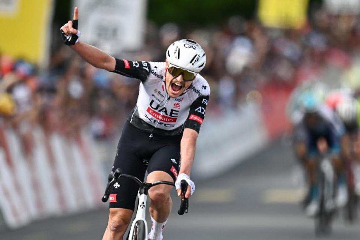 UCI WorldTeam UAE Team Emirates XRG's Australian rider Jay Vine celebrates after crossing the finish line to win the third stage of the Tour of Romandie UCI cycling World tour, 183.1 km loop from the start to the finish in Cossonay, near Vullierens, on May 2, 2025. Fabrice COFFRINI / AFP
