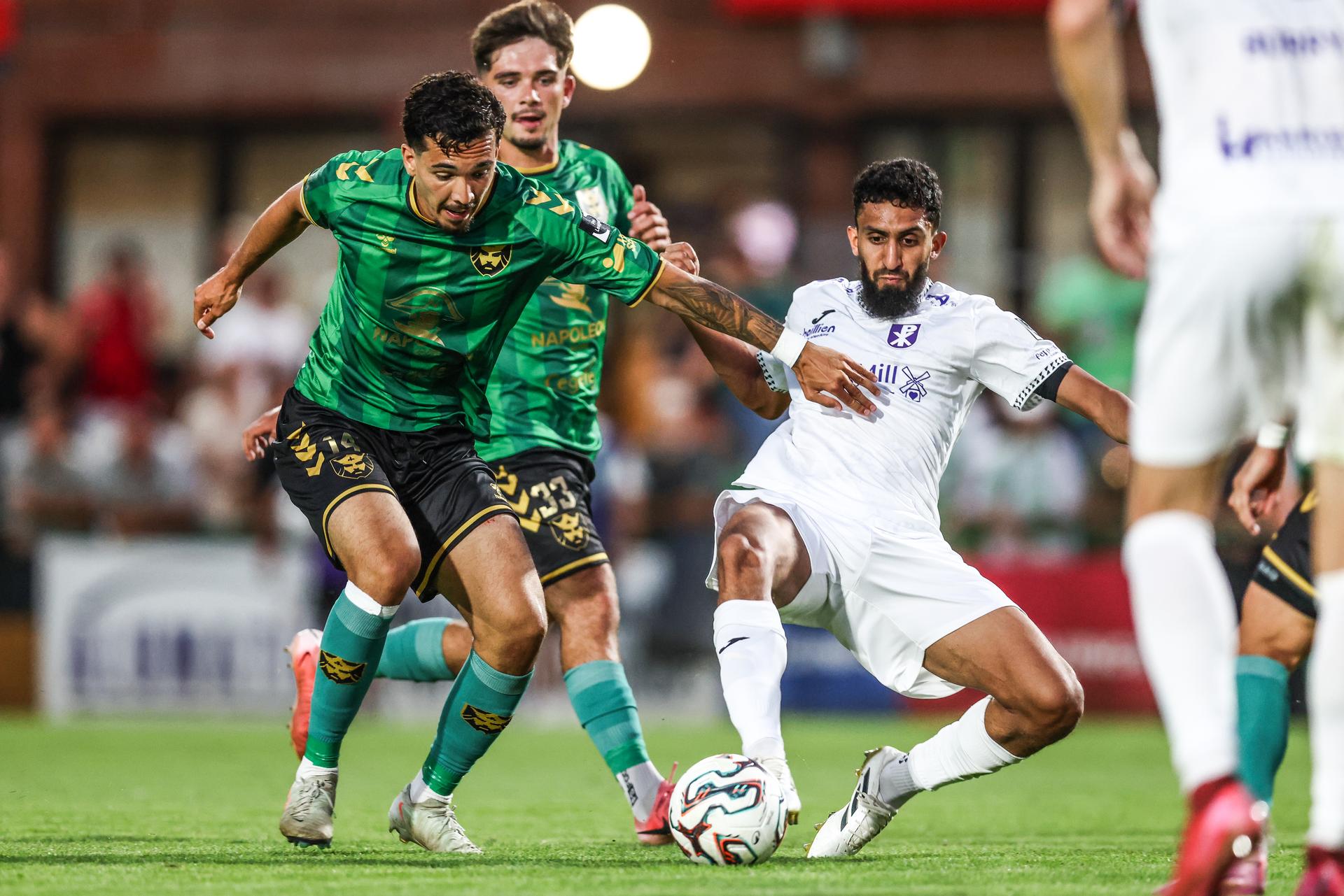 Francs Borains' Lucas Lima and Patro Eisden's Muhammad Carrim fight for the ball during a soccer game between Royal Francs Borains and Patro Eisden Maasmechelen, Friday 15 August 2025 in Boussu, on day 2 of the 2025-2026 'Challenger Pro League' 1B second division of the Belgian championship. BELGA PHOTO BRUNO FAHY