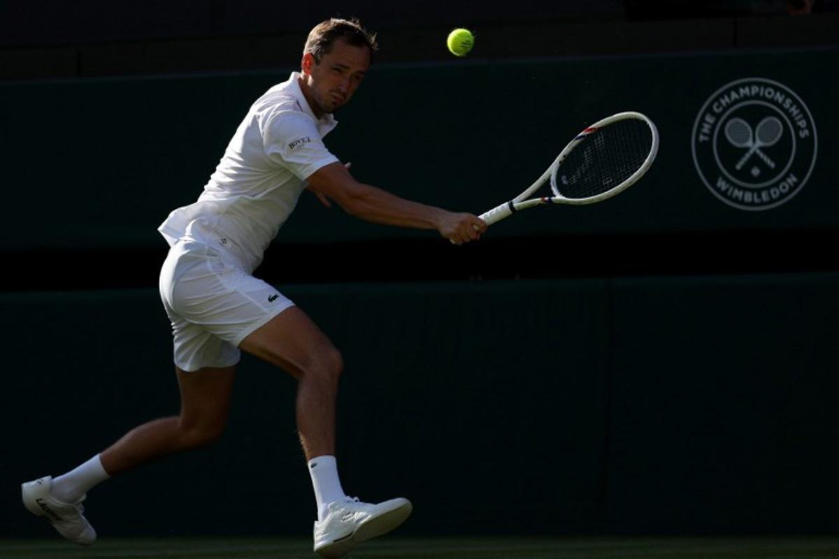 Russia's Daniil Medvedev returns to Croatia's Marin Cilic during their men's singles first round tennis match on the first day of the 2026 Wimbledon Championships at The All England Lawn Tennis and Croquet Club in Wimbledon, southwest London, on June 29, 2026. Adrian Dennis / AFP