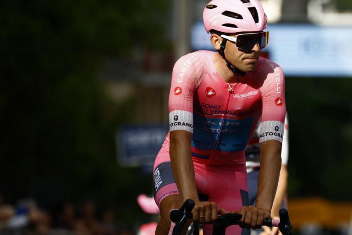 XDS Astana Team Uruguayan rider Guillermo Silva wearing the overall leader's pink jersey (Maglia Rosa) crosses the finish line during the 4th stage of the Giro d'Italia 2026 - Tour of Italy cycling race between Catanzaro and Cosenza, Italy, on May 12, 2026. Luca Bettini / AFP