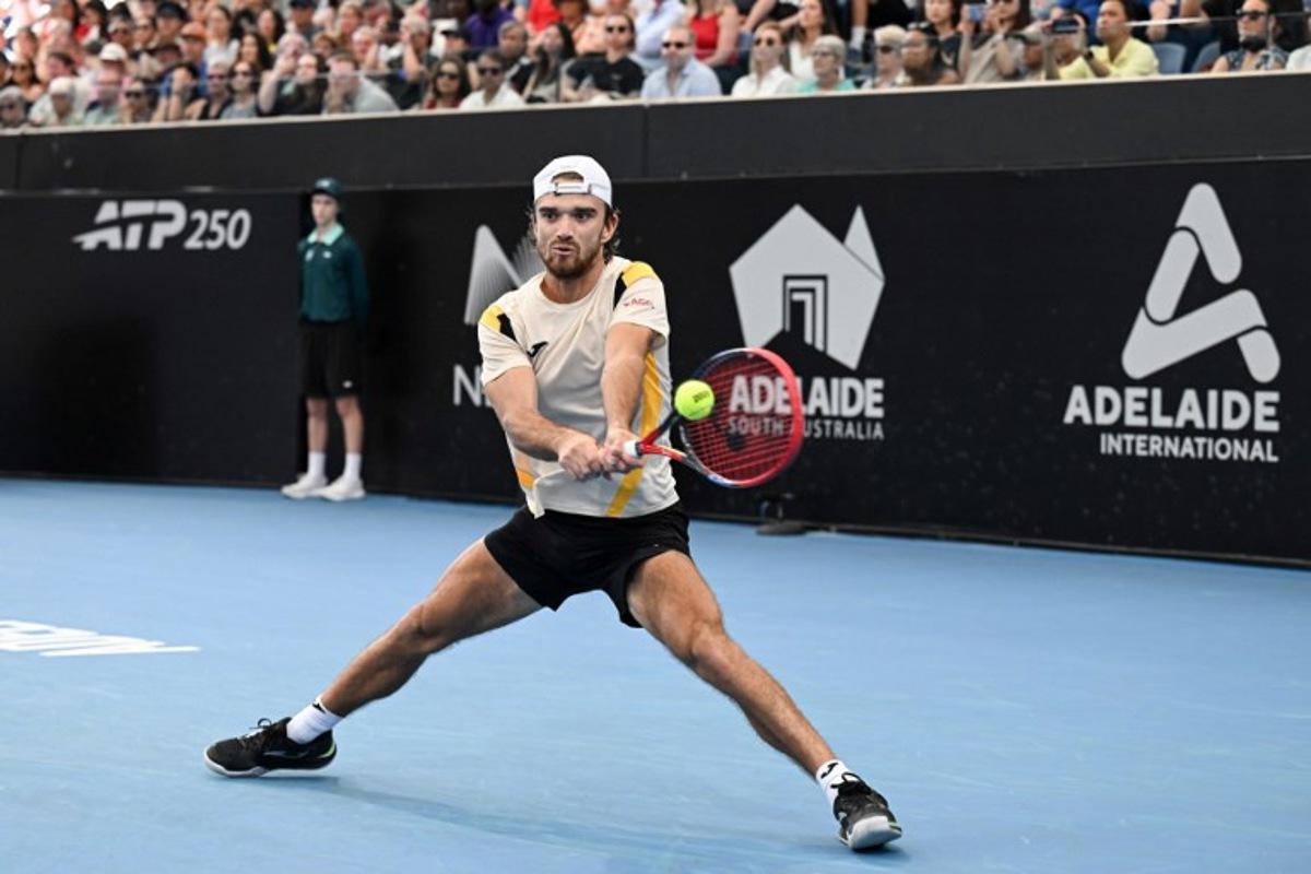 Czech Republic's Tomas Machac hits a return against France's Ugo Humbert in their men's singles final match at the Adelaide International tennis tournament in Adelaide on January 17, 2026. Michael ERREY / AFP