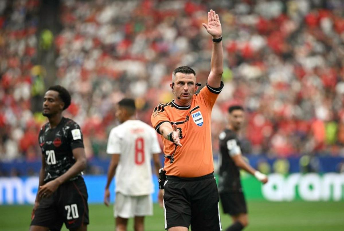 English referee Michael Oliver gestures during the 2026 World Cup round of 16 football match between Canada and Morocco at the Houston Stadium in Houston on July 4, 2026. Paul ELLIS / AFP