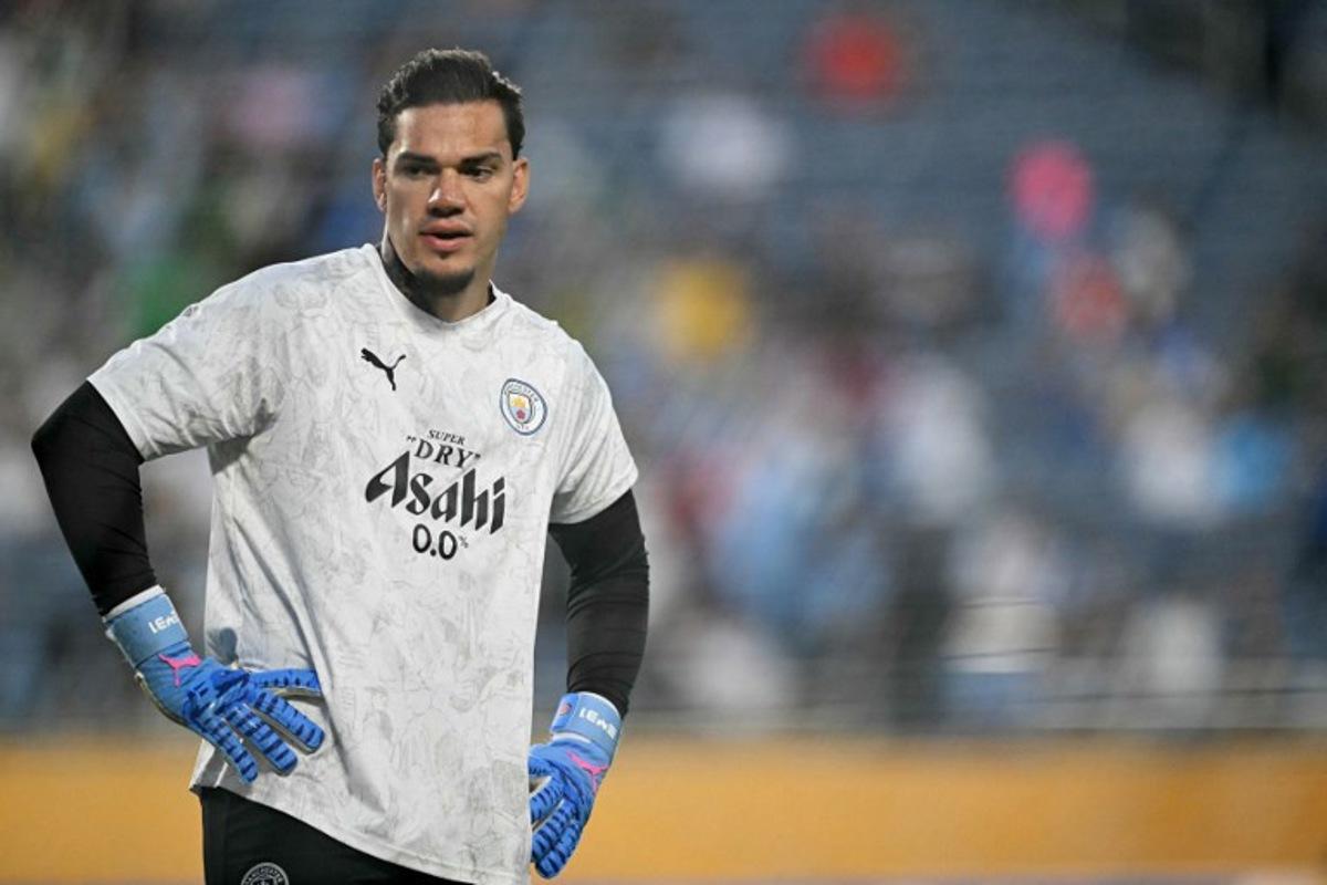 Manchester City's Brazilian goalkeeper #31 Ederson gestures during the warmup ahead of the FIFA Club World Cup 2025 round of 16 football match between England's Manchester City and Saudi's Al-Hilal at the Camping World stadium in Orlando on June 30, 2025. PATRICIA DE MELO MOREIRA / AFP