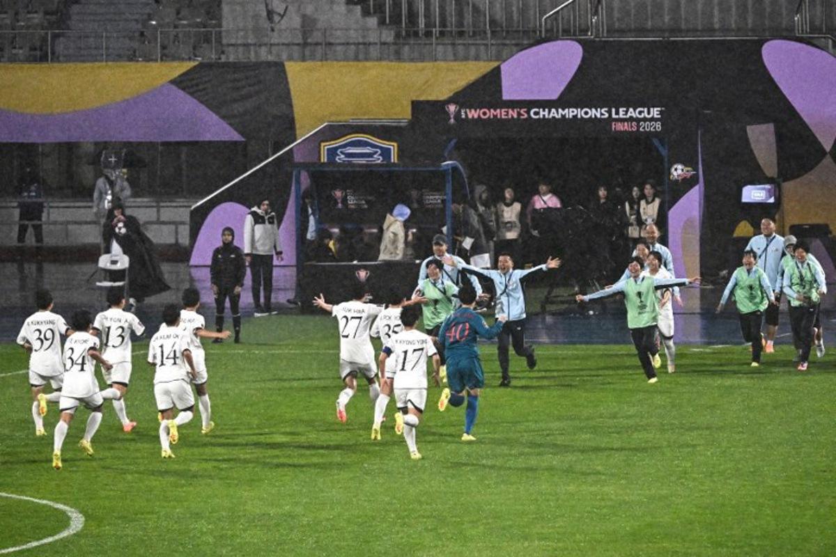 North Korea's Naegohyang Women's FC players celebrate after beating South Korea's Suwon FC Women during the Women's Asian Champions League semi-final football match at Suwon Sports Complex in Suwon on May 20, 2026. Pedro Pardo / AFP