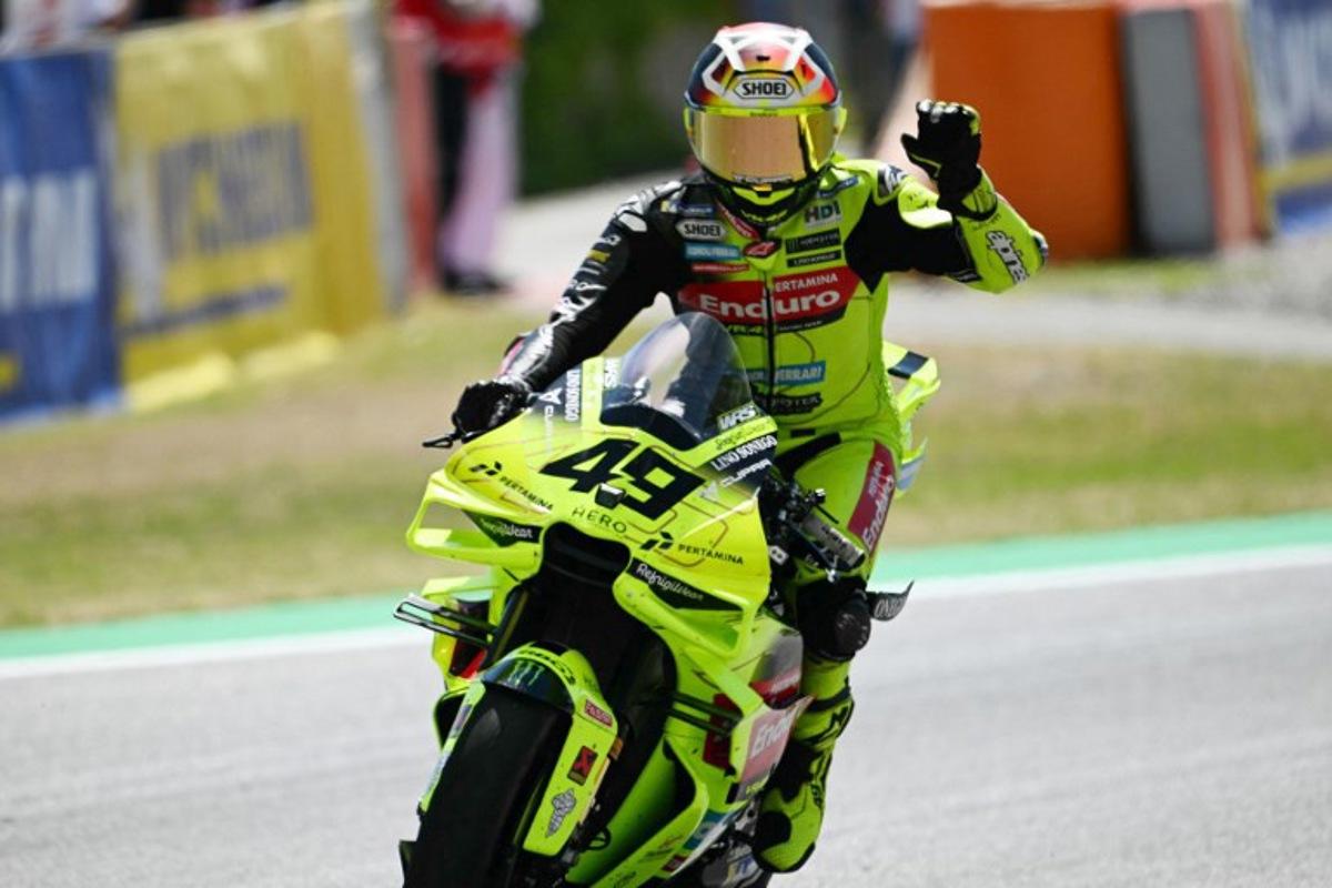 Team Pertamina Enduro VR46 Racing Team's Fabio Di Giannantonio celebrates his thirs place after the Sprint Race at the Catalunya Moto GP Grand Prix at the Catalunya racetrack in Montmelo, near Barcelona, on May 16, 2026. Jose Jordan / AFP