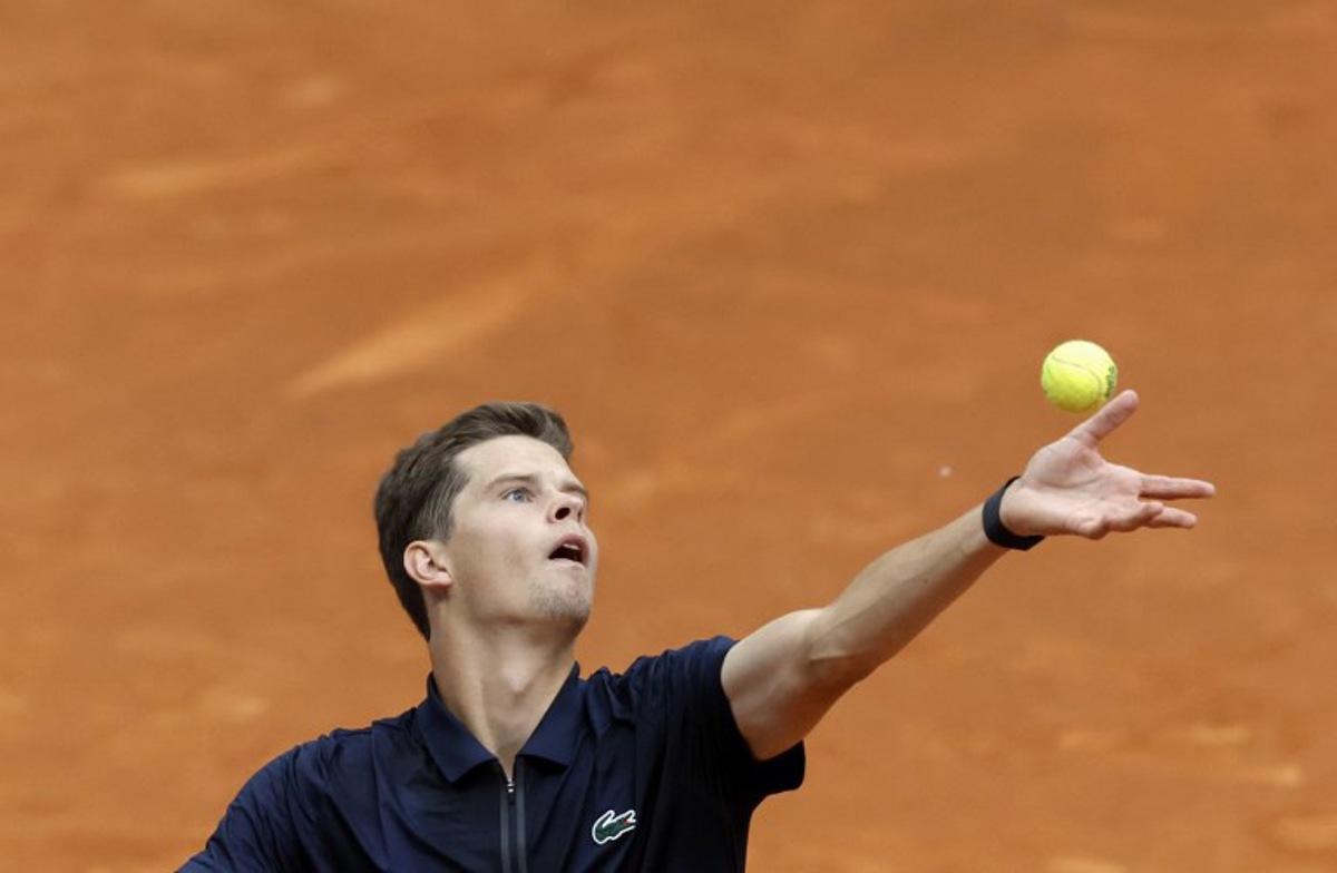Belgium's Alexander Blockx serves to Argentinia's Juan Manuel Cerundolo during their 2026 ATP Tour Madrid Open tennis tournament singles match at the Caja Magica in Madrid, on April 28, 2026. OSCAR DEL POZO / AFP