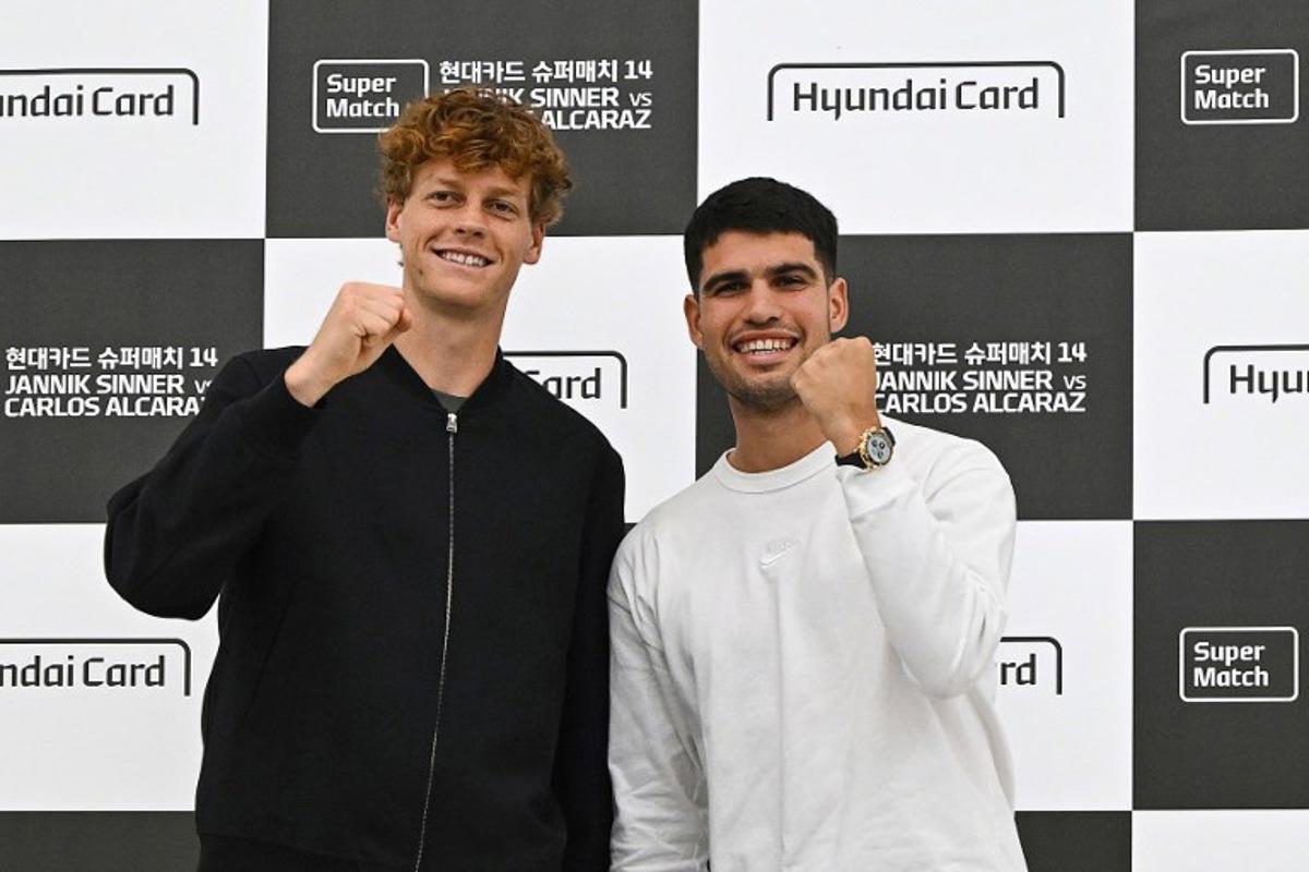 Italy's Jannik Sinner (L) and Spain's Carlos Alcaraz pose for a photo during a press conference at Hyundai Card headquarters in Seoul on January 9, 2026, ahead of their tennis exhibition match. Jung Yeon-je / AFP