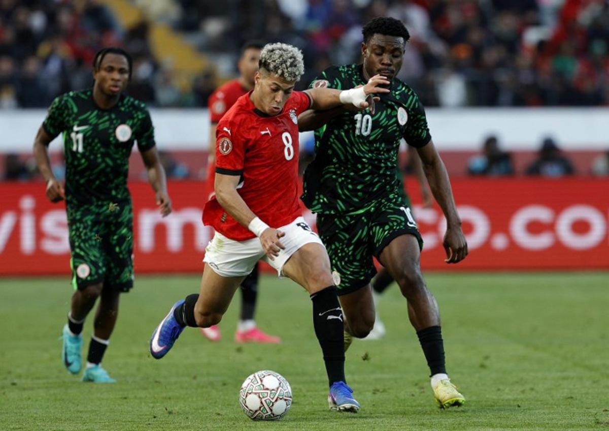 Egypt's midfielder #8 Emam Ashour and Nigeria's midfielder #10 Fisayo Dele-Bashiru compete during the Africa Cup of Nations (CAN) third place football match between Egypt and Nigeria at the Mohammed V Stadium in Casablanca on January 17, 2026. Abdel Majid BZIOUAT / AFP