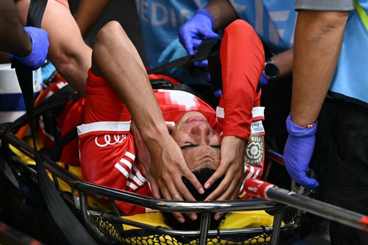 Bayern Munich's German midfielder #42 Jamal Musiala leaves the pitch on a stretcher during the FIFA Club World Cup 2025 quarterfinal football match between France's Paris Saint-Germain and Germany's Bayern Munich at the Mercedes-Benz Stadium in Atlanta on July 5, 2025. PATRICIA DE MELO MOREIRA / AFP