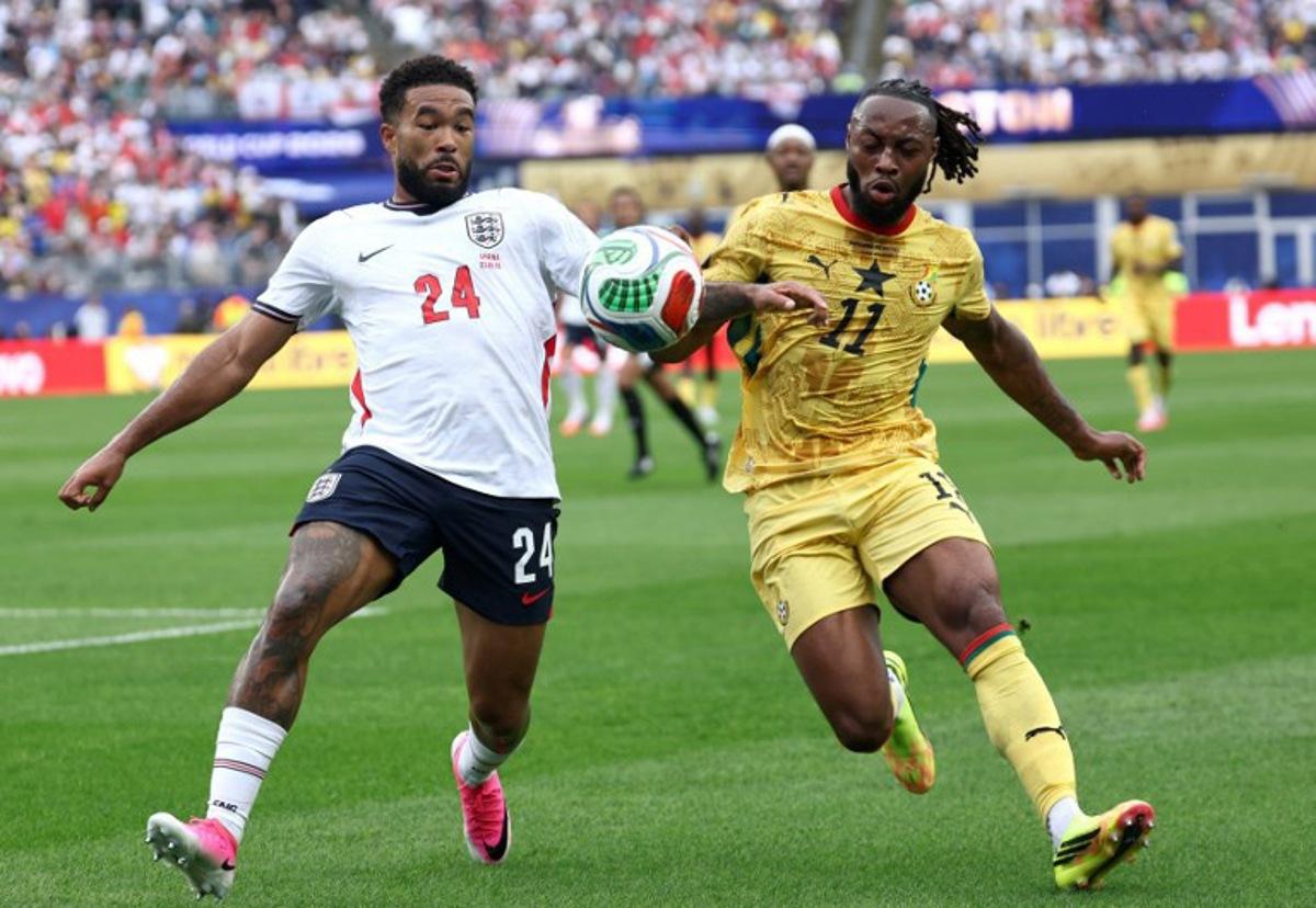 England's defender #24 Reece James (L) fights for the ball with Ghana's forward #11 Antoine Semenyo during the 2026 World Cup Group L football match between England and Ghana at the Boston Stadium in Foxborough on June 23, 2026. FRANCK FIFE / AFP