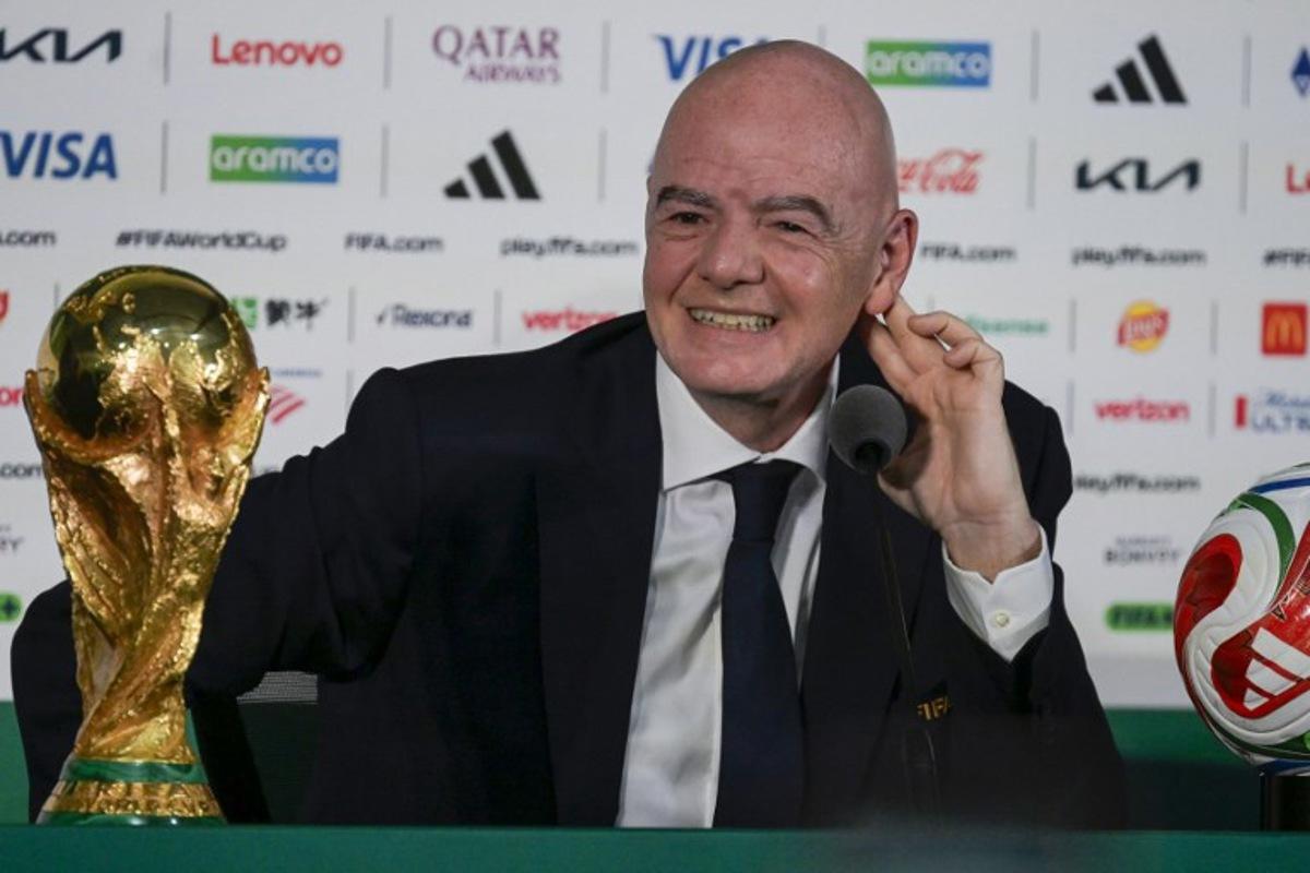 FIFA President Gianni Infantino gestures during a press conference with the World Cup trophy on the eve of the opening match of the 2026 World Cup football tournament at Mexico city stadium in Mexico City on June 10, 2026. Alfredo ESTRELLA / AFP