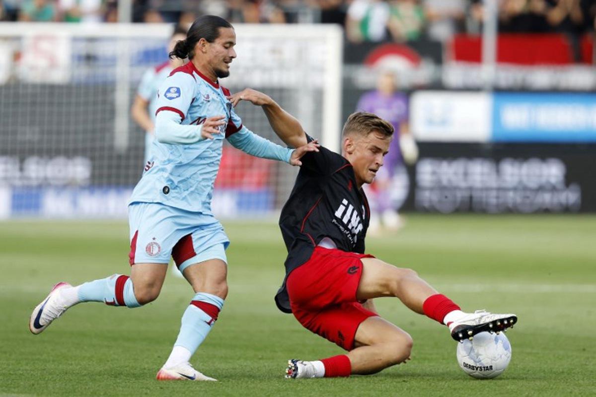Feyenoord's French forward #23 Anis Hadj Moussa (L) and Excelsior's Swedish defender #04 Casper Widell (R) fight for the ball during the Dutch Eredivisie football match between SBV Excelsior and Feyenoord at the Woudestein Stadium in Rotterdam on August 16, 2025. Bas Czerwinski / ANP / AFP