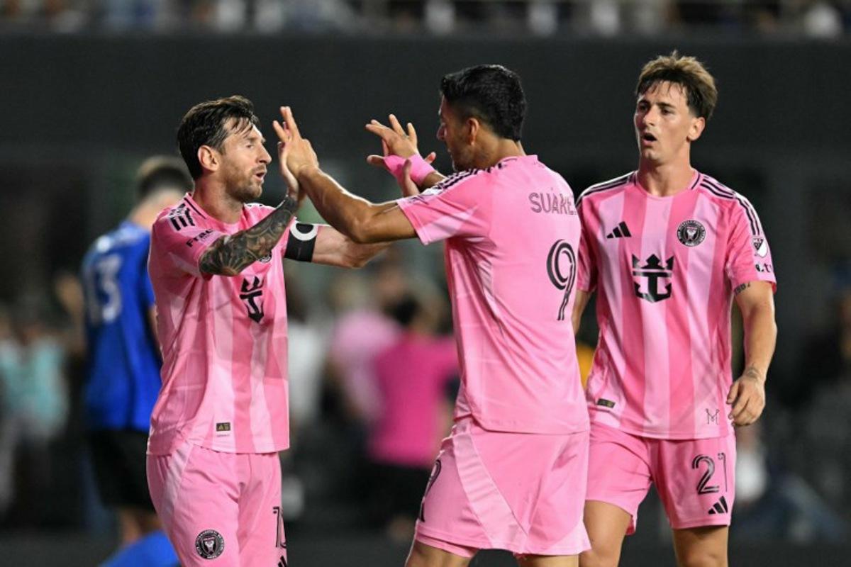 Inter Miami's Uruguayan forward #09 Luis Suarez celebrates scoring his team's second goal with Inter Miami's Argentine forward #10 Lionel Messi (L) during the Major League Soccer match between Inter Miami CF and CF Montreal at Chase Stadium in Fort Lauderdale, Florida, on May 28, 2025. CHANDAN KHANNA / AFP