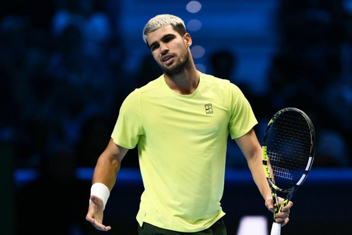 Spain's Carlos Alcaraz reacts during the men's single final match against Italy's Jannik Sinner at the ATP Finals tennis tournament, in Turin, on November 16, 2025. Marco BERTORELLO / AFP