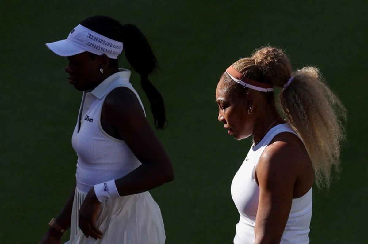 US player Serena Williams (R) walks with Canada's Victoria Mboko (L) while playing against US player Nicole Melichar-Martinez and New Zealand's Erin Routliffe during their round of 16, doubles match at the HSBC WTA tennis Championships at Queen's Club in west London on June 9, 2026. Adrian Dennis / AFP