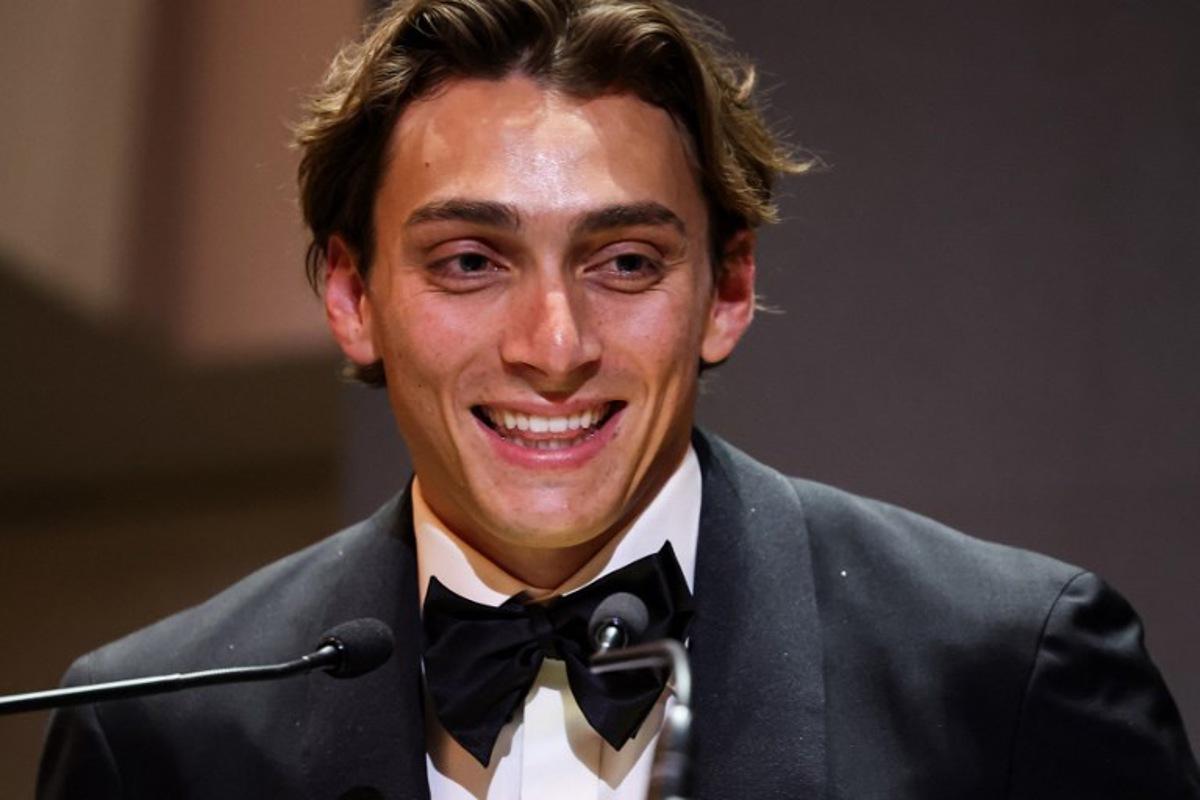Sweden's world pole vault champion Armand Duplantis delivers a speech on stage after receiving the Men's World athlete of the year award during the World Athletics Awards 2025 in Monaco, on November 30, 2025. Valery HACHE / AFP