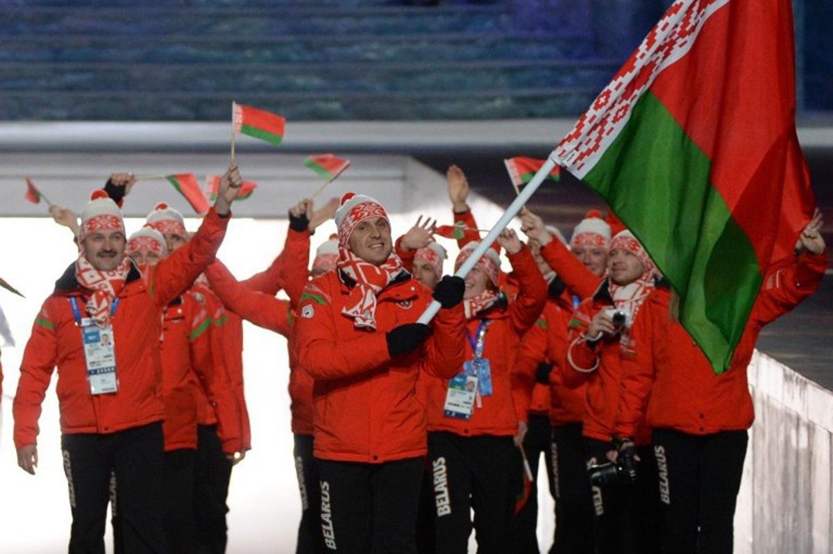 Belarus' flag bearer, freestyle skier Aleksei Grishin, leads his national delegation during the Opening Ceremony of the 2014 Sochi Winter Olympics at the Fisht Olympic Stadium on February 7, 2014 in Sochi. AFP PHOTO / ANDREJ ISAKOVIC Andrej ISAKOVIC / AFP