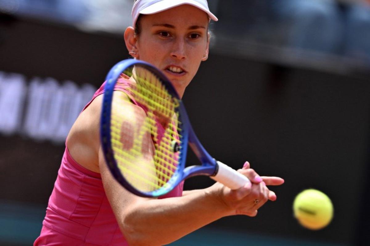 Belgium's Elise Mertens hits a return to Italy's Jasmine Paolini during the WTA Rome Open tennis tournament at Foro Italico in Rome on May 9, 2026. Tiziana FABI / AFP