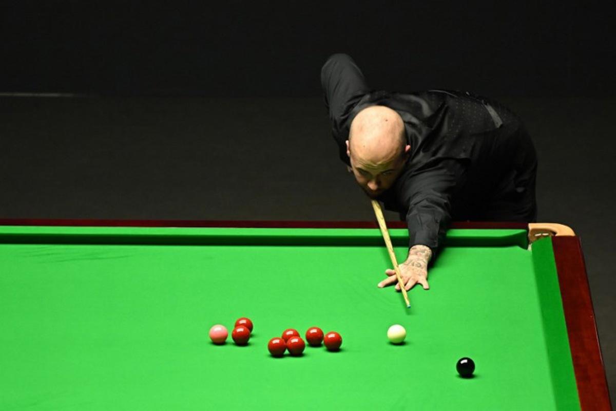 Belgium's Luca Brecel plays a shot against England's Mark Selby during the evening session on day two of their World Championship Snooker final match at The Crucible in Sheffield, northern England on May 1, 2023. Oli SCARFF / AFP