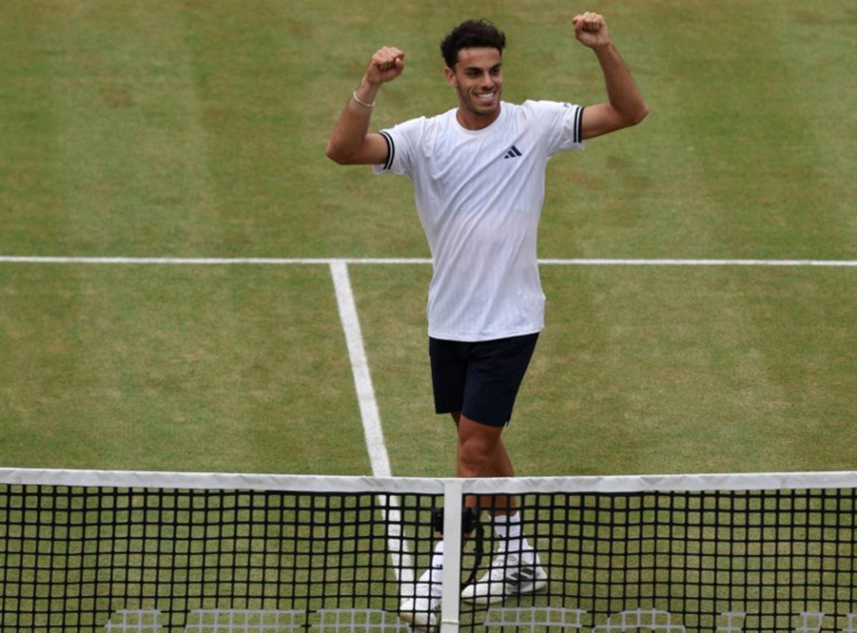 Argentina's Francisco Cerundolo celebrates winning against US player Brandon Nakashima during their men's singles semi-final tennis match on day six of the ATP HSBC Championships at Queen's Club in west London on June 20, 2026. Cerundolo won the match 6-7, 6-3, 6-4. Adrian Dennis / AFP