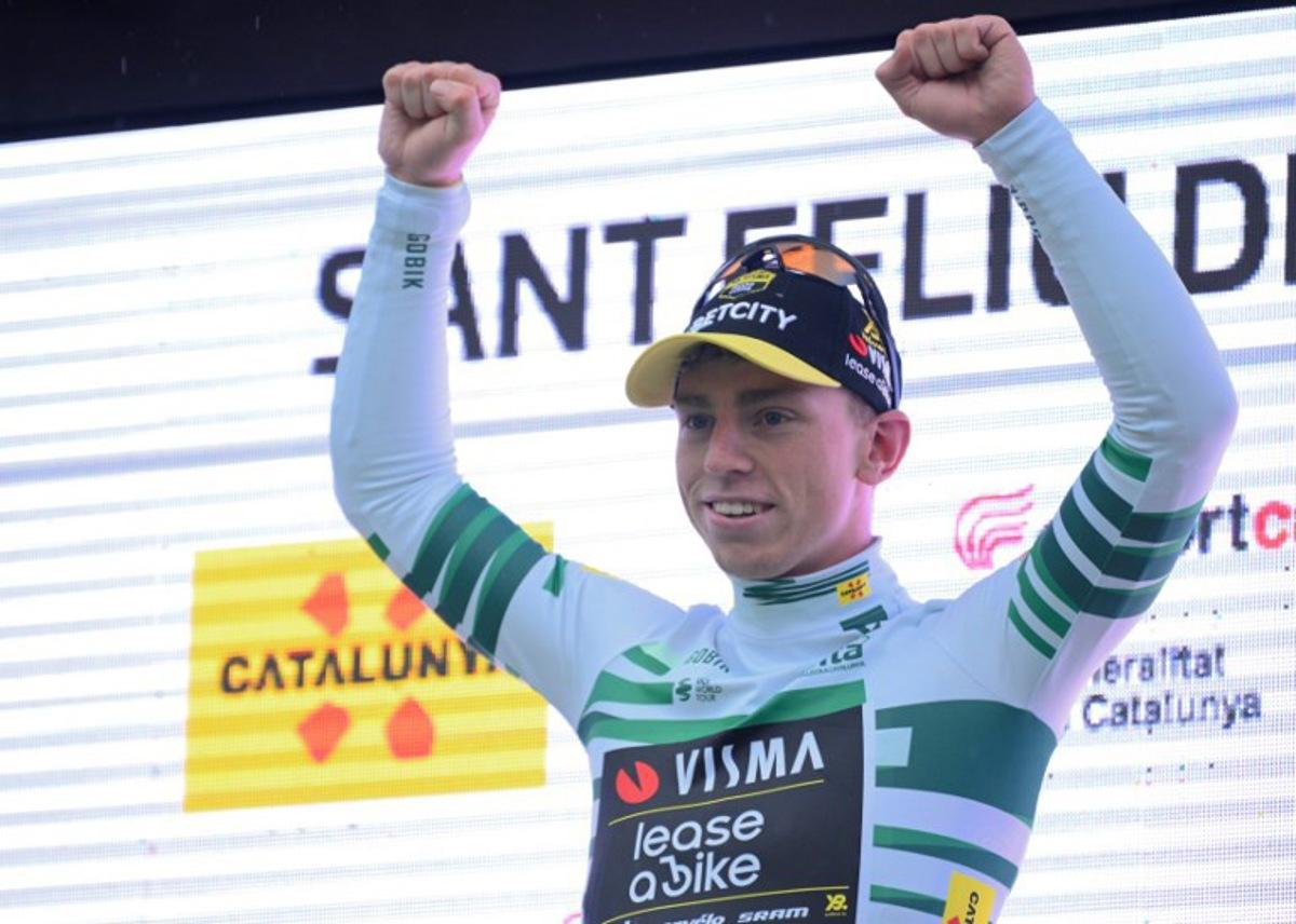 Stage winner Team Visma's British rider James Matthew Brennan celebrates on the podium of the first stage of the 2025 Volta a Catalonya cycling tour of Catalonya, a 178,3 km loop starting and finishing in Sant Feliu de Guixols, on March 24, 2025. Josep LAGO / AFP