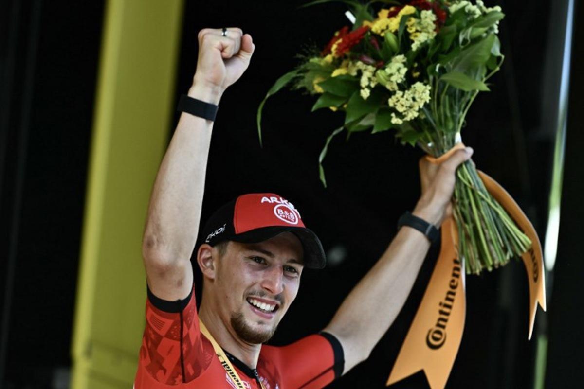 Arkea - B&B Hotels team's French rider Kevin Vauquelin celebrates on the podium after winning the 2nd stage of the 111th edition of the Tour de France cycling race, 199 km between Cesenatico and Bologna, in Italy, on June 30, 2024. Marco BERTORELLO / AFP