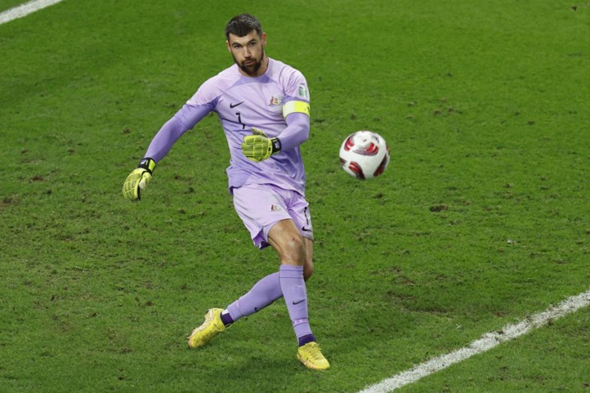 Australia's goalkeeper #01 Mathew Ryan crosses the ball during the Qatar 2023 AFC Asian Cup quarter-final football match between Australia and South Korea at Al-Janoub Stadium in al-Wakrah, south of Doha, on February 2, 2024. KARIM JAAFAR / AFP