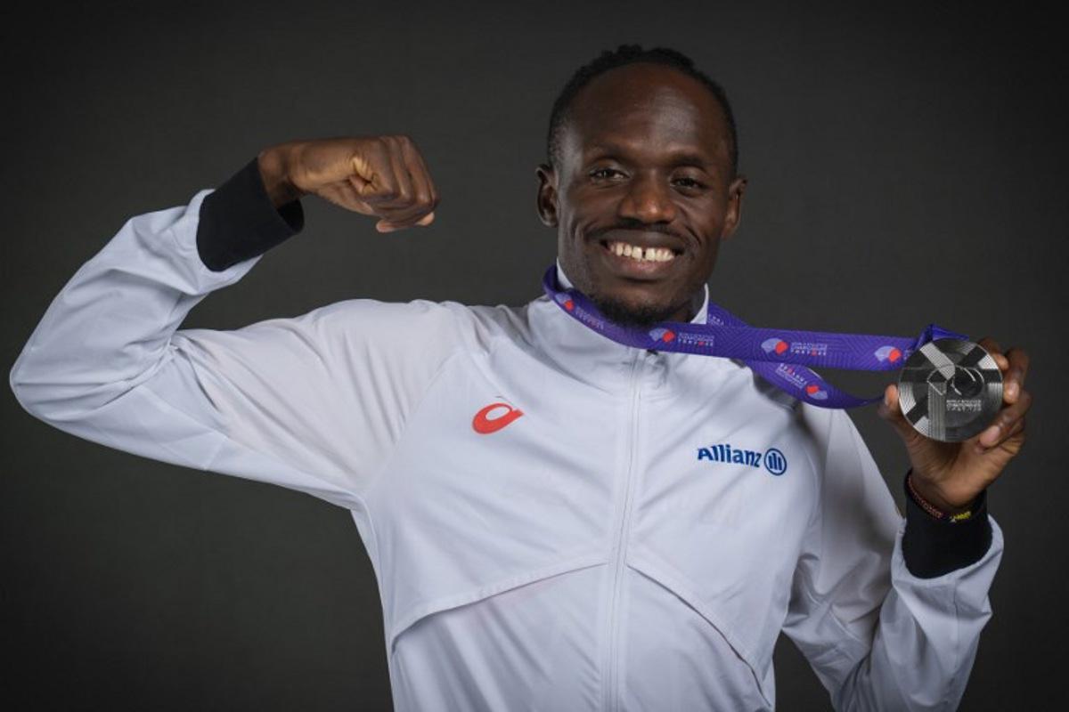 Silver medallist in the men's 5000m event Belgium's athlete Isaac Kimeli poses for portraits during a studio photo session on the sidelines of the World Athletics Championships in Tokyo on September 21, 2025. Andrej ISAKOVIC / AFP