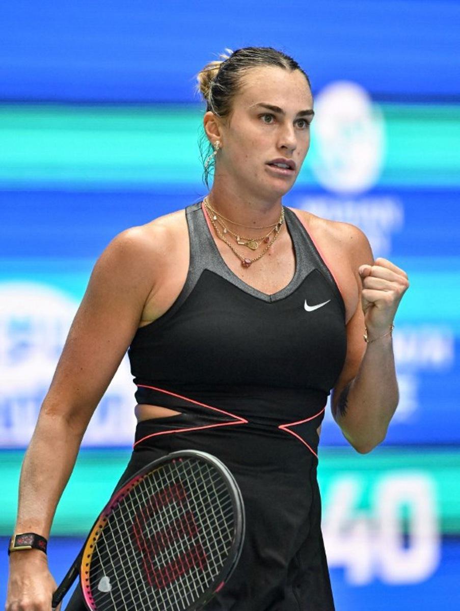 Belarus' Aryna Sabalenka celebrates after winning against Kazakhstan's Elena Rybakina during their women's singles quarterfinal match at the Wuhan Open tennis tournament in Wuhan, Central China's Hubei province on October 10, 2025. ADEK BERRY / AFP