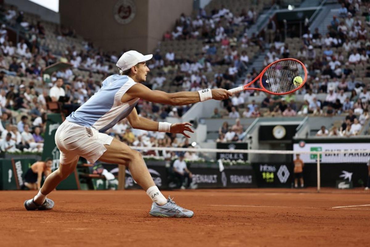 Italy's Matteo Arnaldi plays a forehand return to US Frances Tiafoe during their men's singles match on day 9 of the French Open tennis tournament on Court Suzanne-Lenglen at the Roland-Garros Complex in Paris on June 1, 2026. Anne-Christine POUJOULAT / AFP