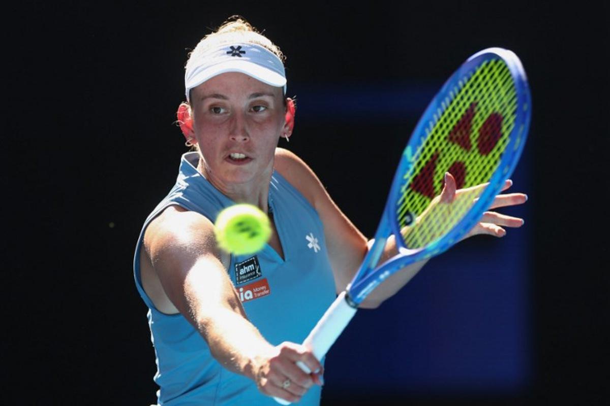 Belgium's Elise Mertens hits a return to Kazakhstan's Elena Rybakina during their women's singles match on day nine of the Australian Open tennis tournament in Melbourne on January 26, 2026. IZHAR KHAN / AFP