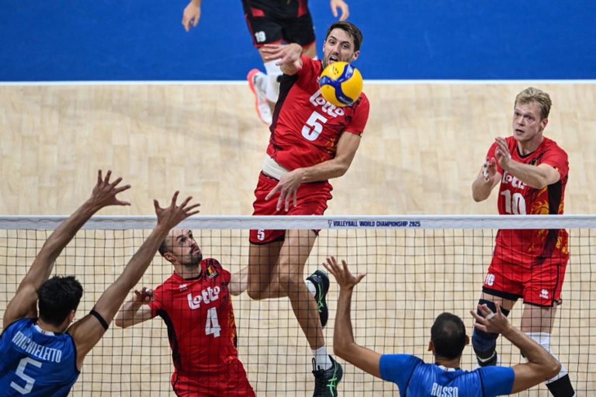 Belgium's Pieter Coolman (C) spikes the ball during the 2025 Men's Volleyball World Championship quarter-final match between Belgium and Italy at the Mall of Asia Arena in Pasay City, Metro Manila, on September 24, 2025. Jam STA ROSA / AFP