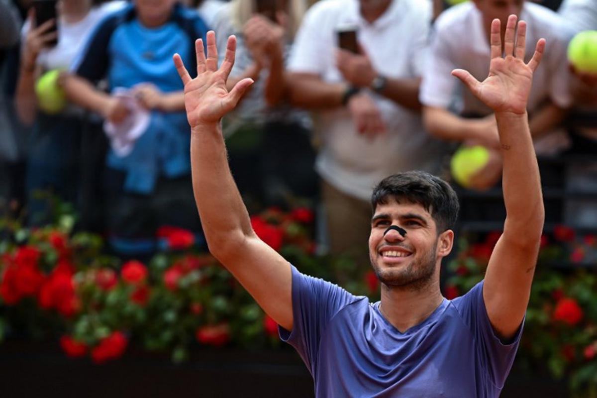 Spain's Carlos Alcaraz celebrates after victory in his men's singles match against Serbia's Dusan Lajovic for the ATP Rome Open tennis tournament at Foro Italico in Rome on May 9, 2025. PIERO CRUCIATTI / AFP