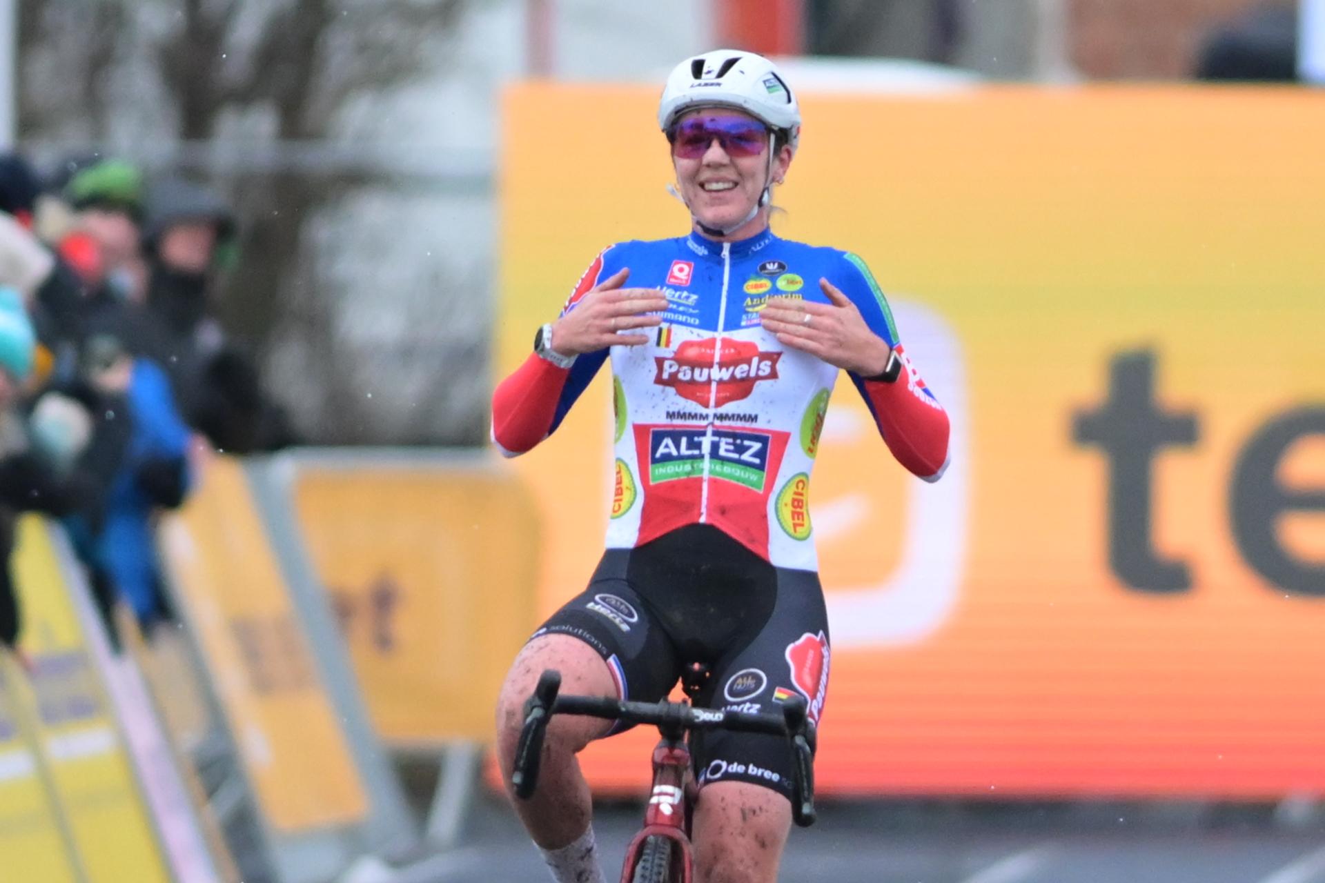 French Amandine Fouquenet celebrates as she crosses the finish line to win the women elite race at the cyclocross cycling event in Gullegem on Saturday 03 January 2026, stage 7/8 in the Superprestige cyclocross cycling competition BELGA PHOTO DAVID PINTENS