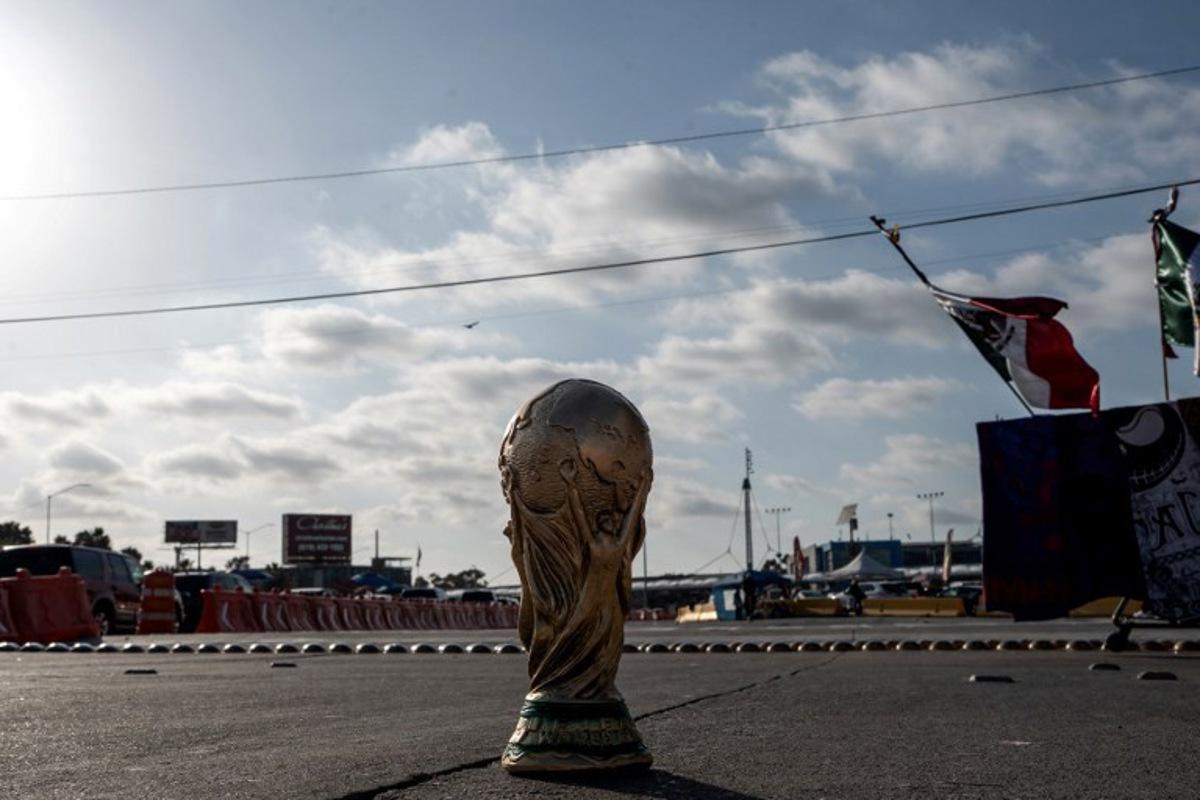 A World Cup trophy souvenir is pictured on a street in Tijuana, Baja California state, Mexico on May 23, 2026. Iran are moving their World Cup training base to Tijuana, Mexico, after football's world governing body FIFA approved a request to transfer it from Tucson, Arizona, the head of Iran's football federation Mehdi Taj said on May 23, 2026. Chris Noyola / AFP