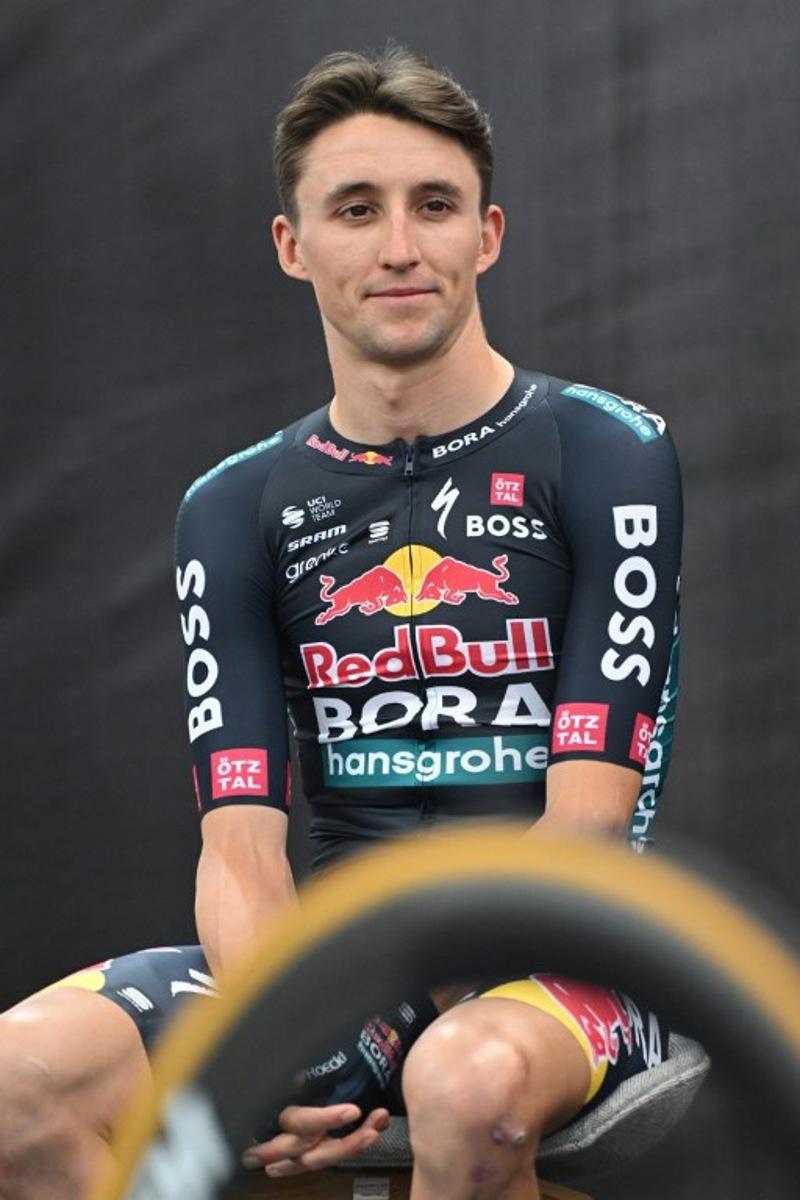 Australia's Jai Hindley attends the presentation of the new Red Bull-Bora-Hansgrohe cycling team in Salzburg, Austria, on June 26, 2024. Red Bull on June 26, 2024 unveiled its eight-rider cycling team to debut in this week's Tour de France, marking the energy drink maker's latest expansion of its sports empire. Earlier this year, Red Bull bought a controlling stake in the German Bora-Hansgrohe cycling team. KERSTIN JOENSSON / AFP