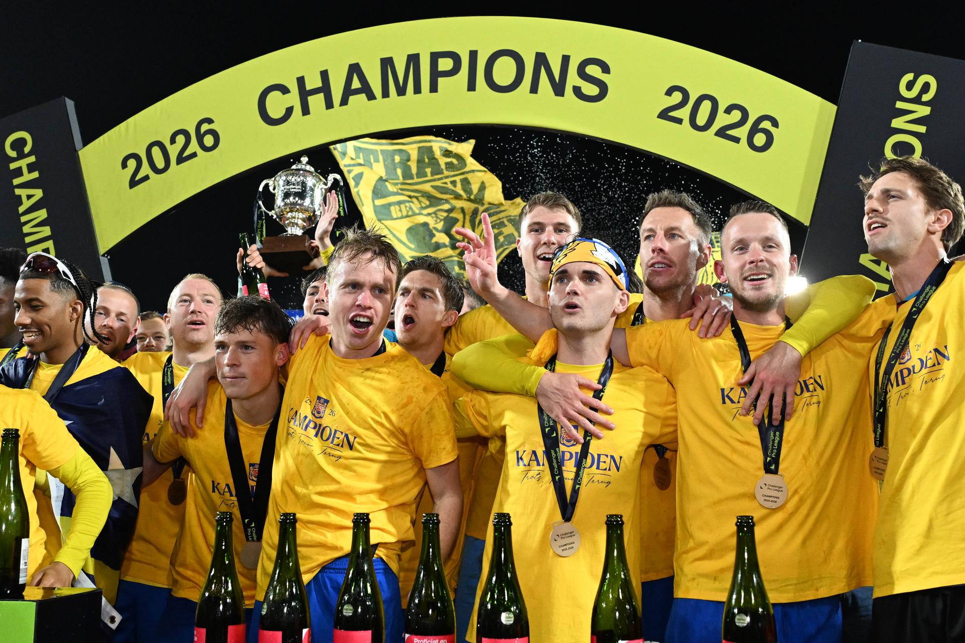 Players of Beveren celebrate as Beveren is the champion with a victory in the 29th day (out of 34) in a soccer game against RWDM Brussels, Wednesday 11 March 2026 in Beveren, on day 29 of the 2025-2026 'Challenger Pro League' 1B second division of the Belgian championship. BELGA PHOTO MAARTEN STRAETEMANS